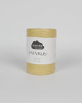 A sandy beige ball of raffia yarn on a white background