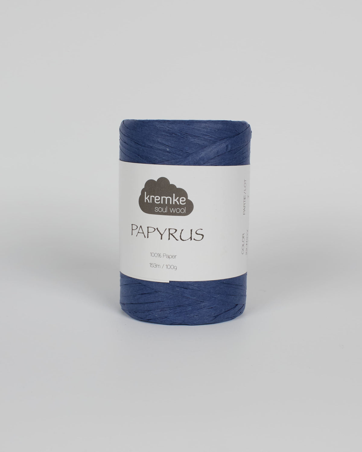 A dark blue ball of raffia yarn on a white background
