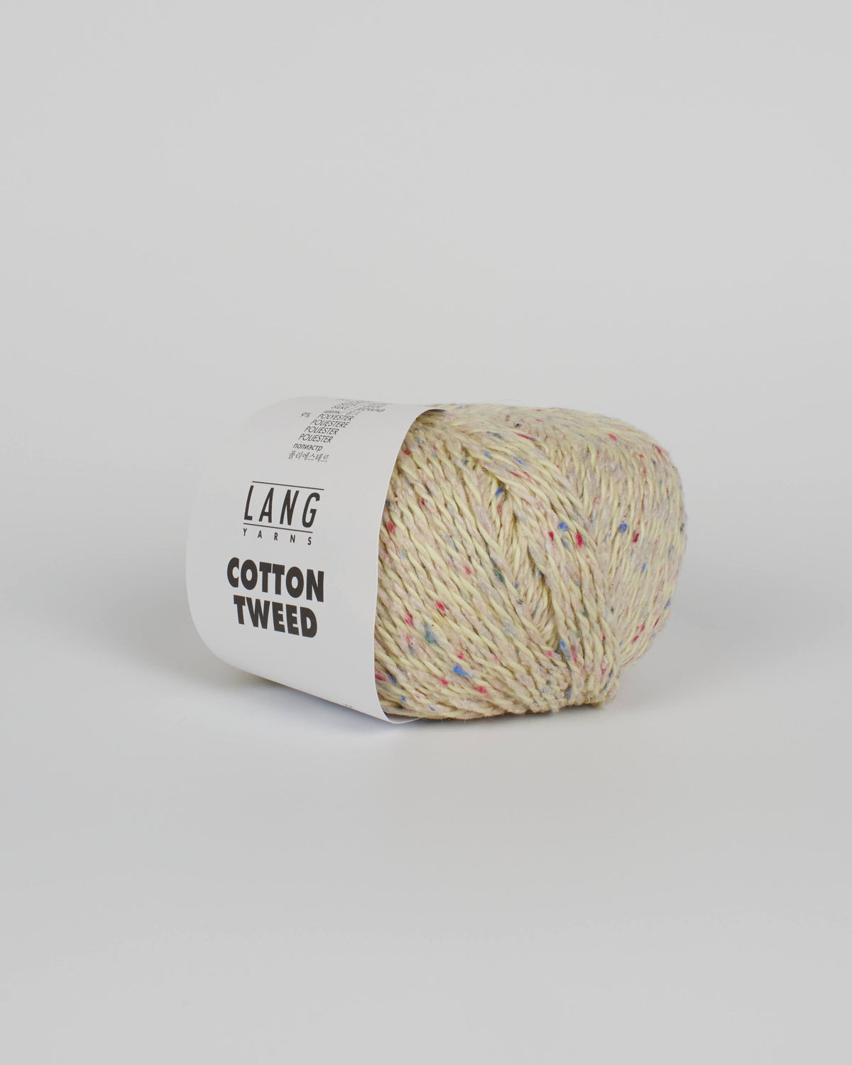 A cream ball of yarn with multicoloured tweed flecks on a white background