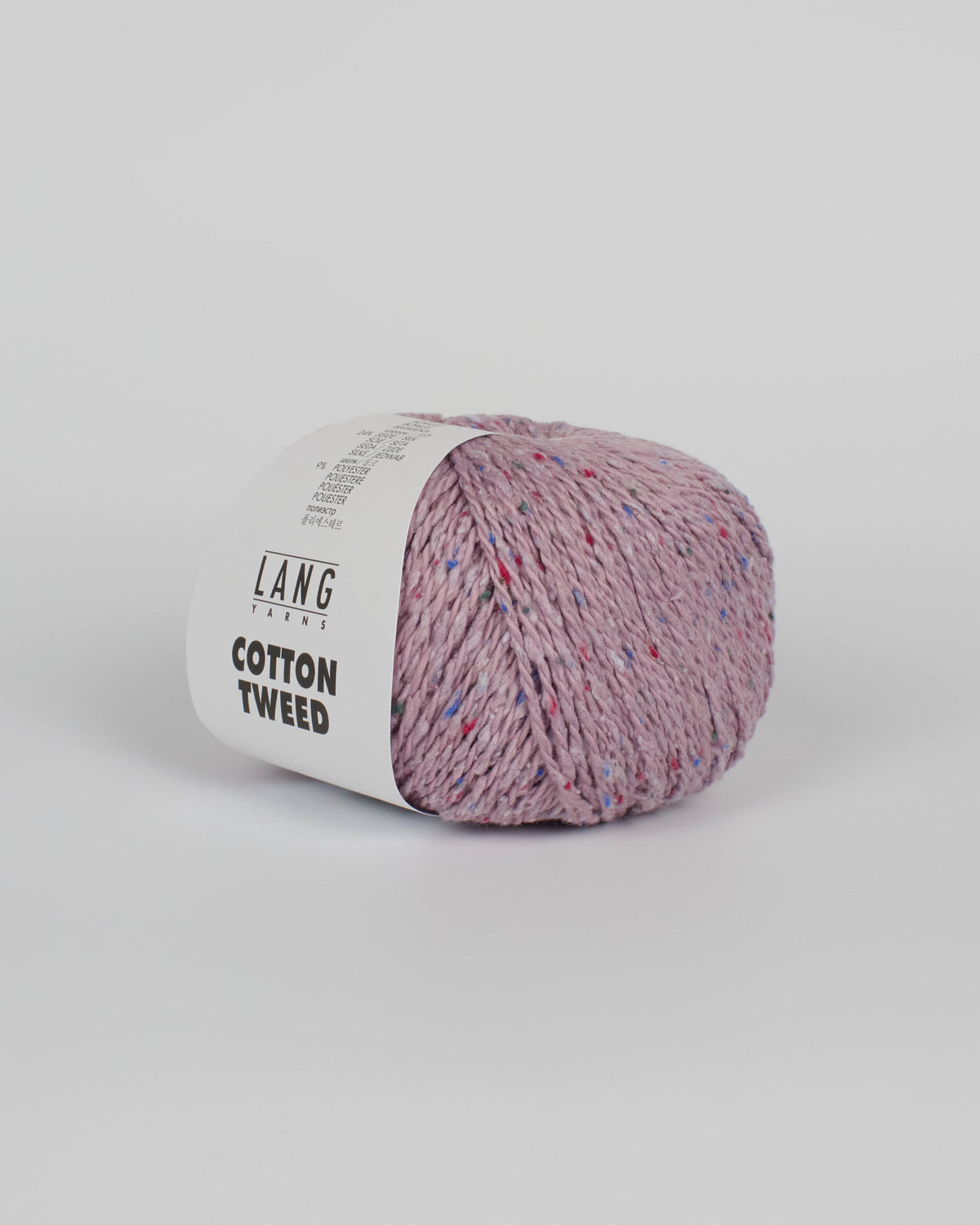 A lilac ball of yarn with multicoloured tweed flecks on a white background