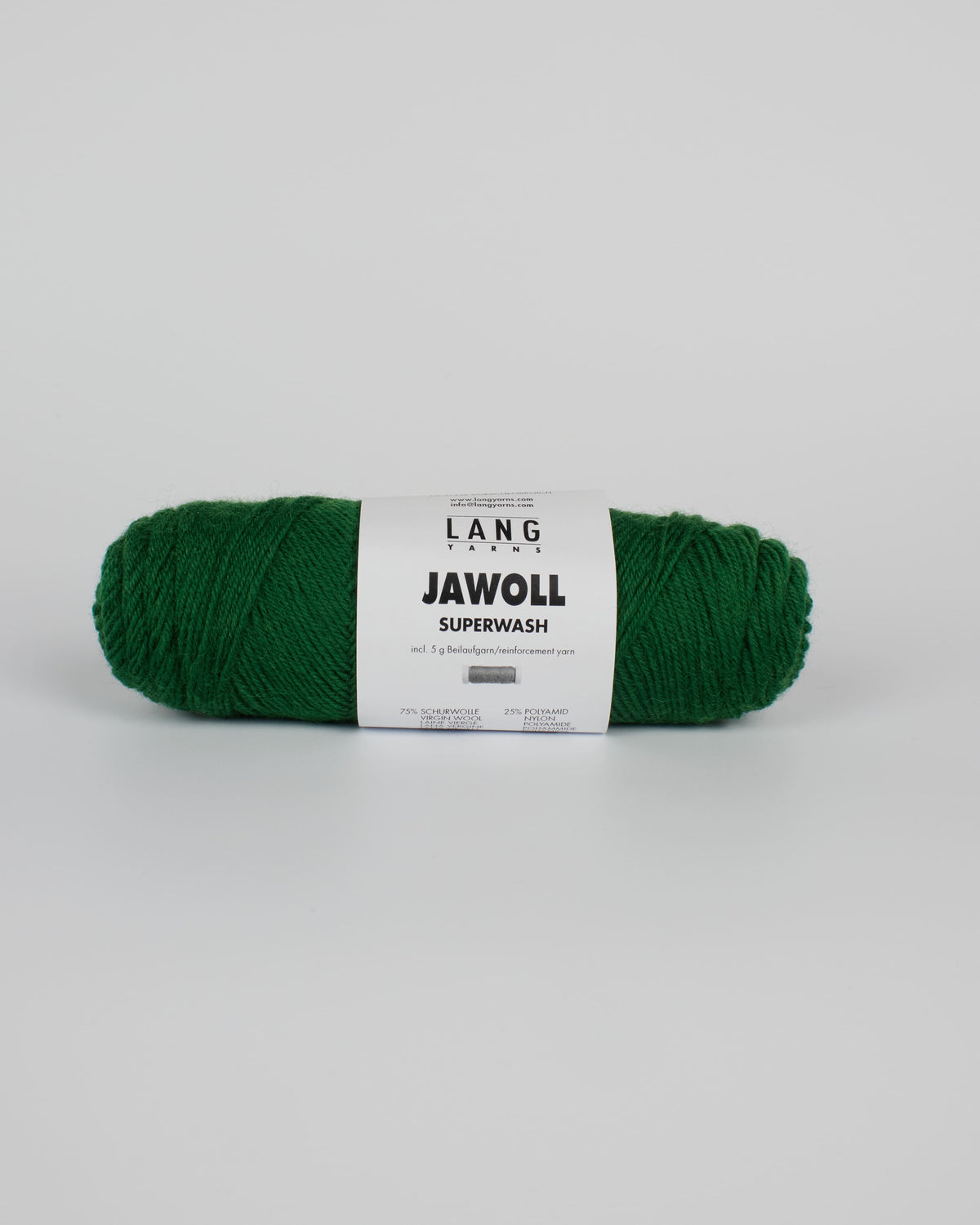 An emerald green ball of yarn on a white background