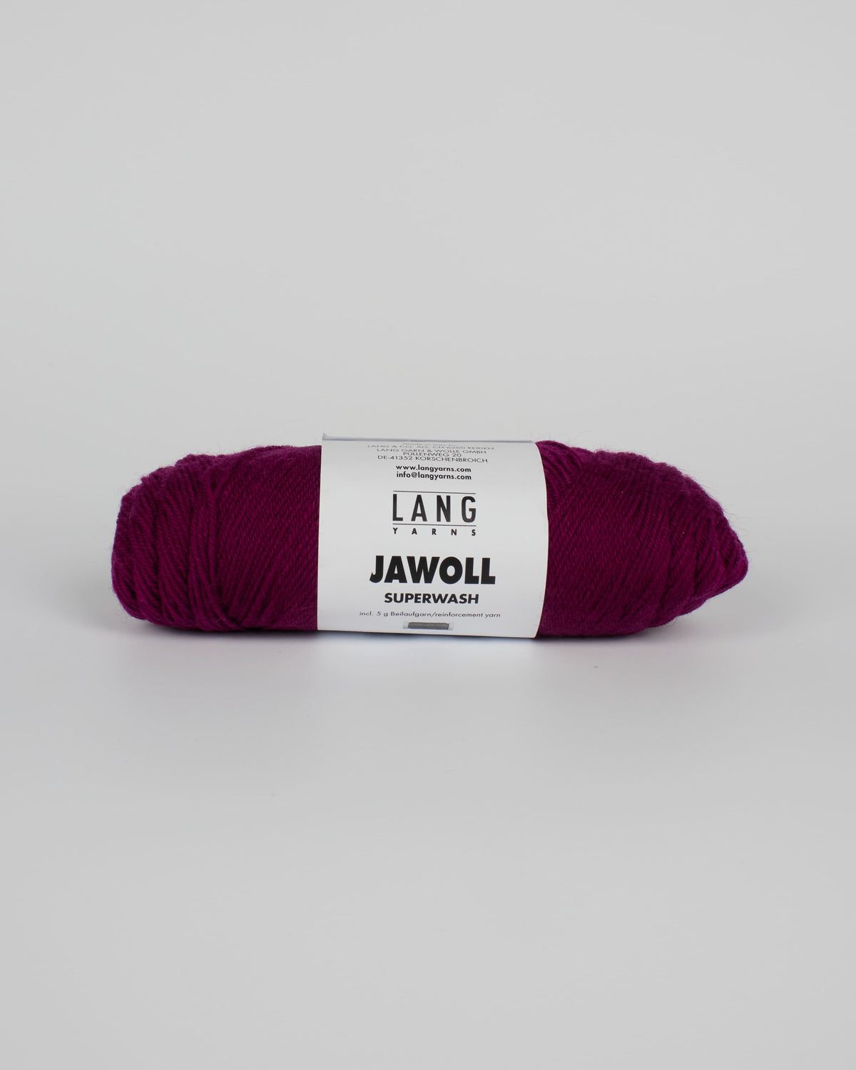 A purple ball of yarn on a white background