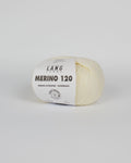 An off white ball of yarn on a white background