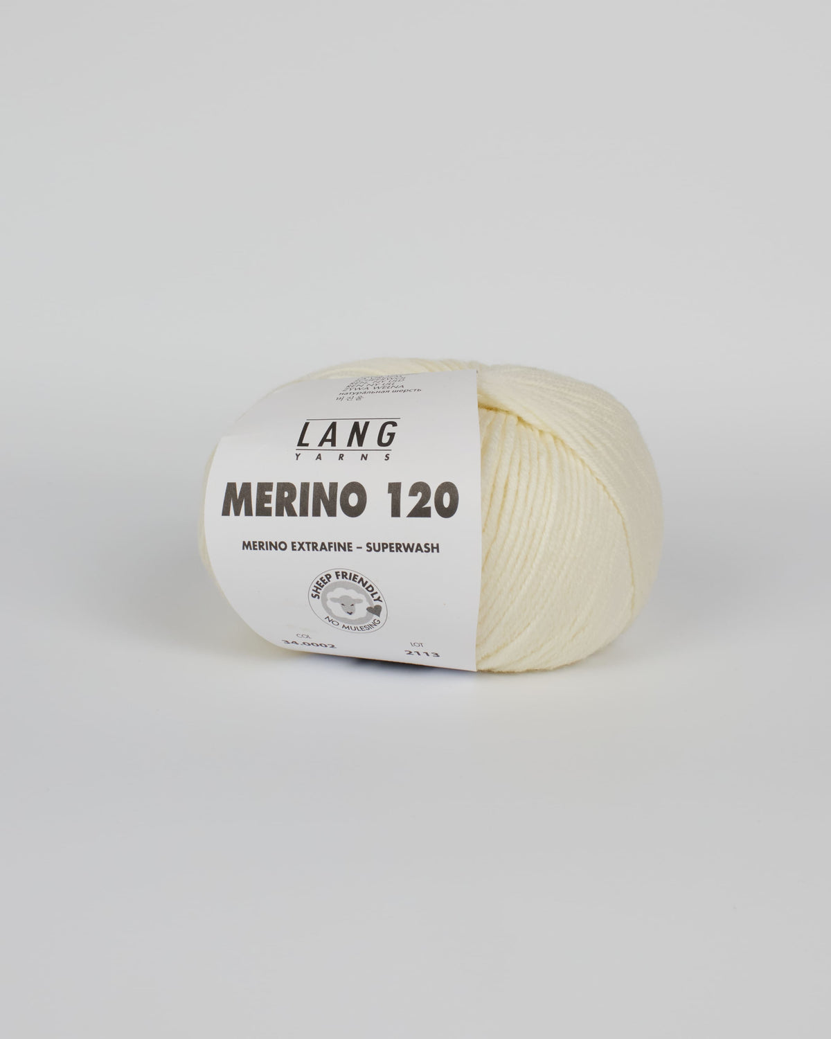 An off white ball of yarn on a white background