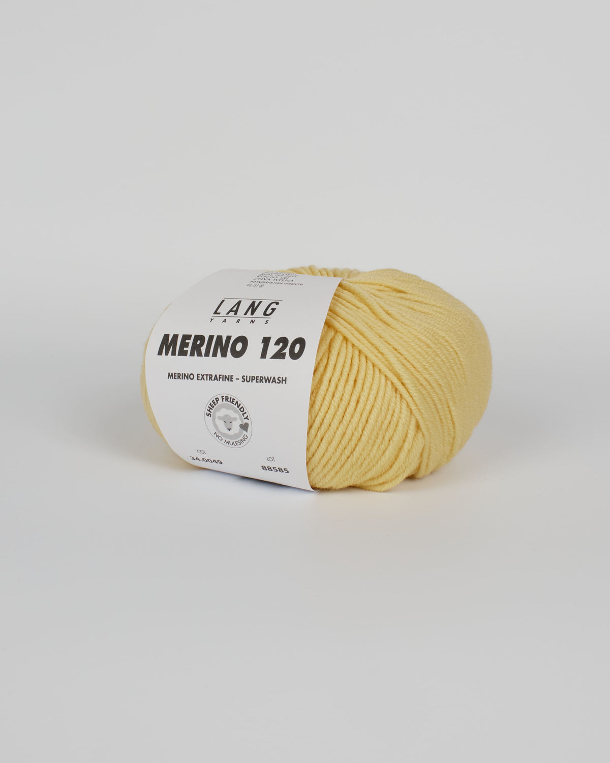 A butter yellow ball of yarn on a white background