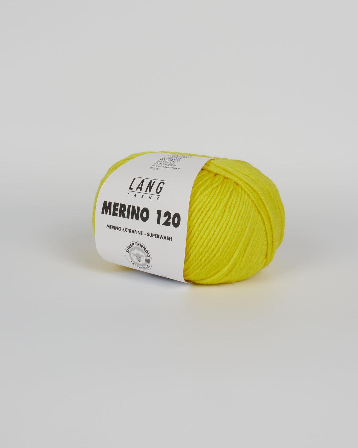 A lemon yellow ball of yarn on a white background