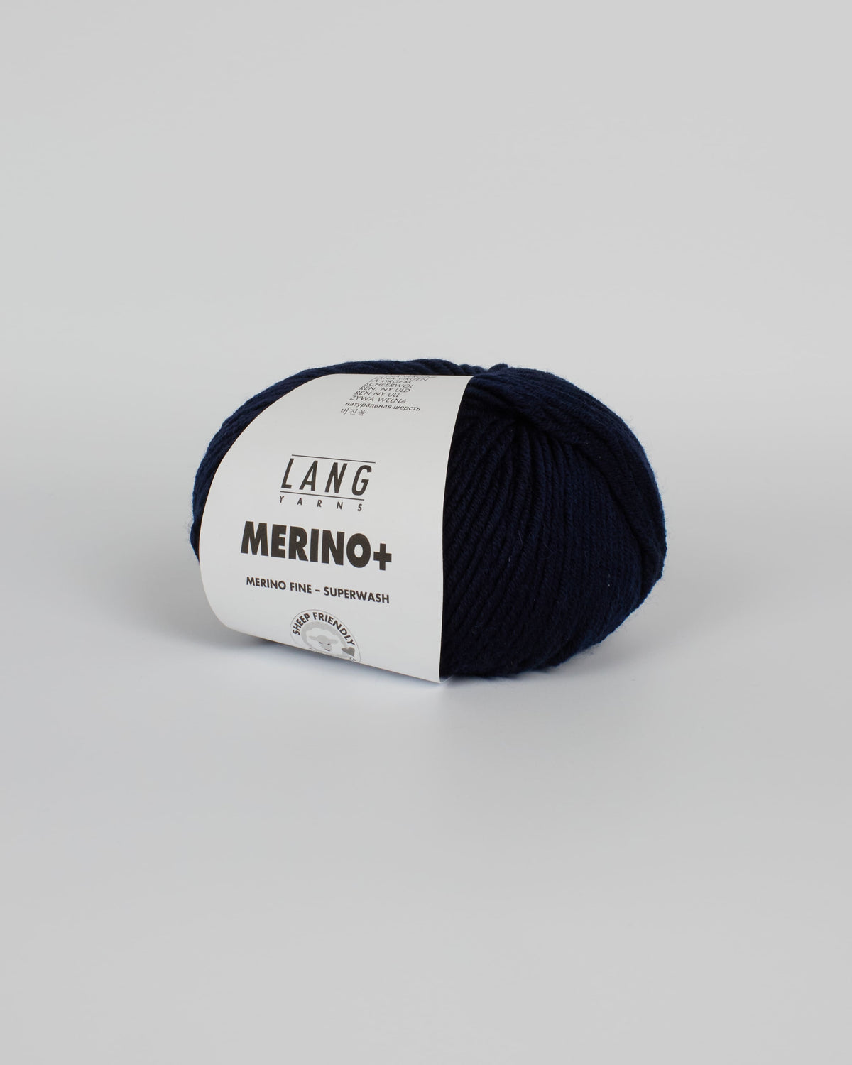 A navy blue ball of yarn on a white background