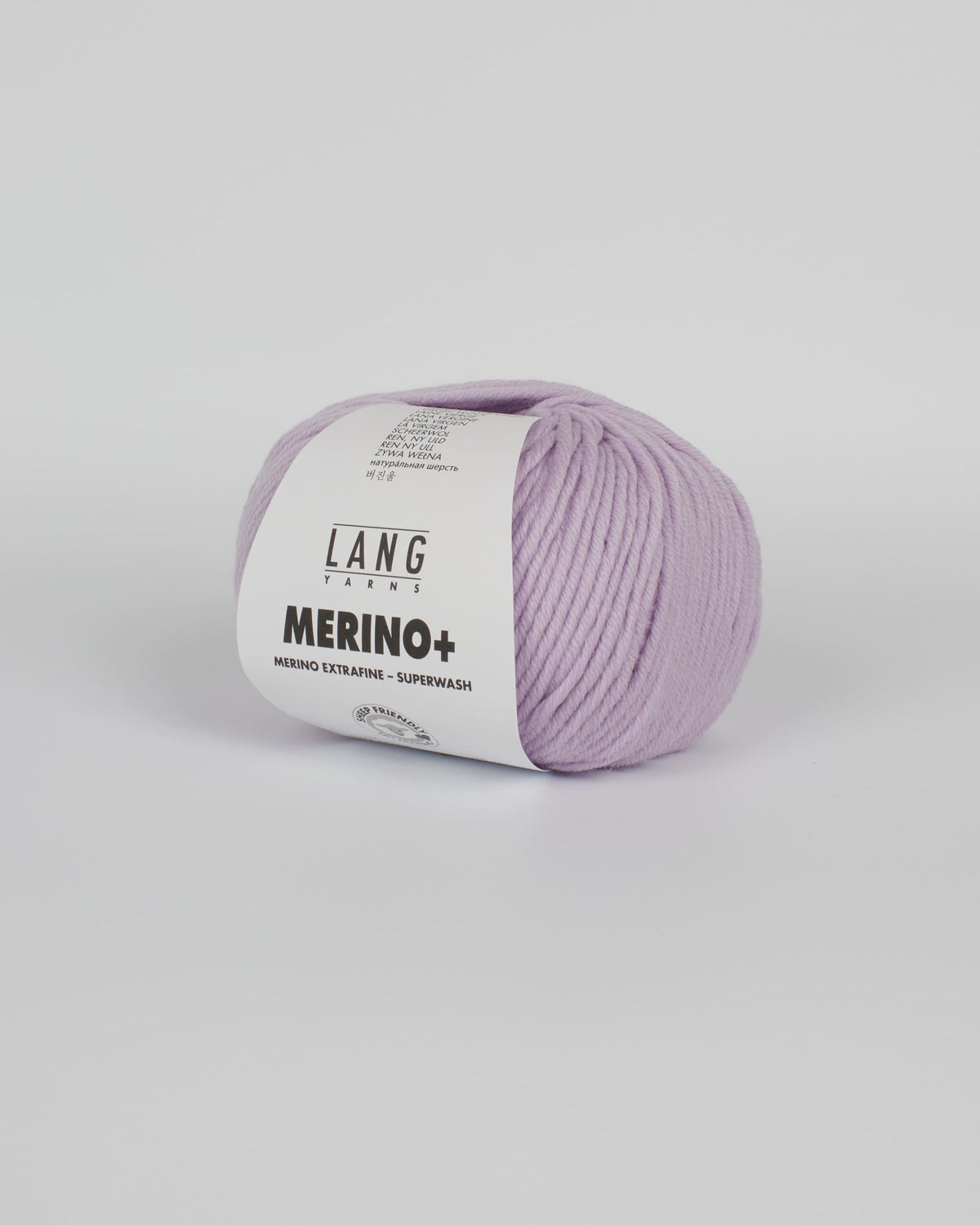 A pale lilac ball of yarn on a white background
