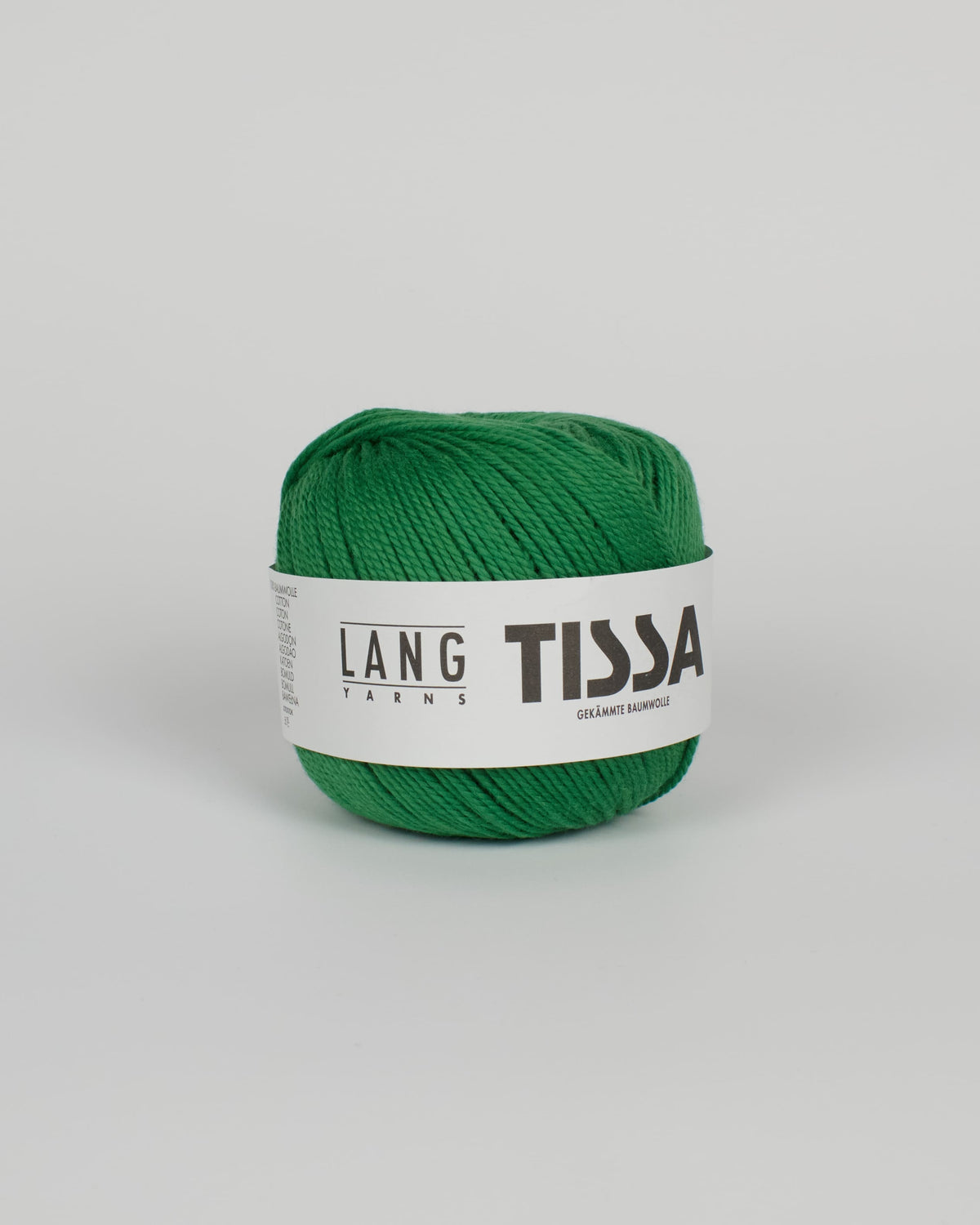 An emerald green ball of yarn on a white background